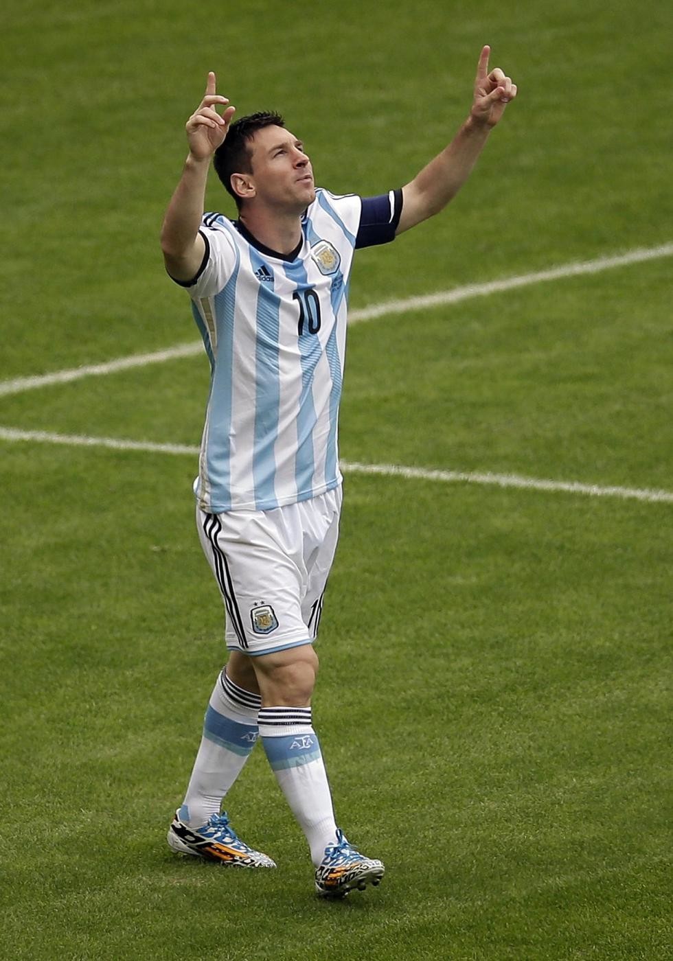 Argentina's Lionel Messi celebrates scoring his side's first goal during the group F World Cup soccer match between Nigeria and Argentina at the Estadio Beira-Rio in Porto Alegre, Brazil, Wednesday, June 25, 2014. (AP Photo/Michael Sohn)